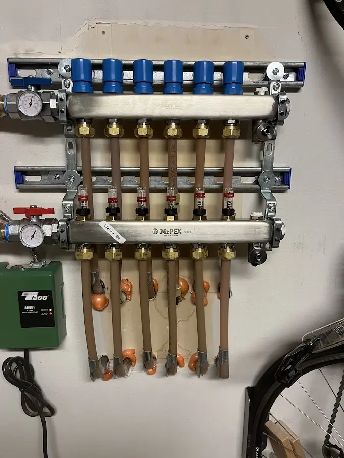 Plumber performing Water Heater Repair at a residential property in East Vincent